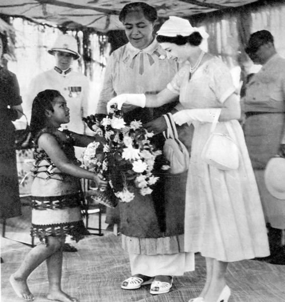 Queen Elizabeth II meeting a young Tongan girl