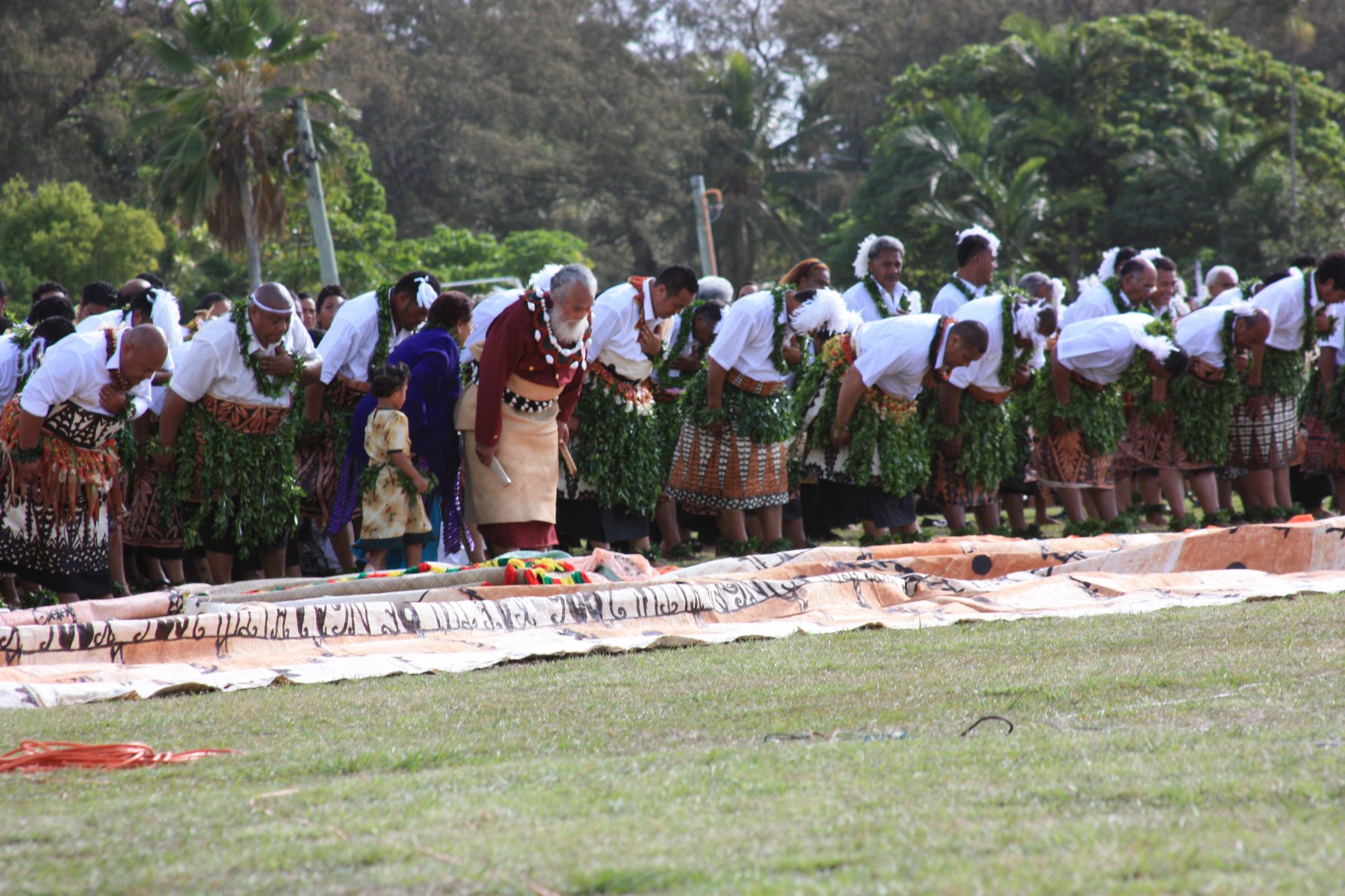 Tongan leaders taking part in a ceremonial bow