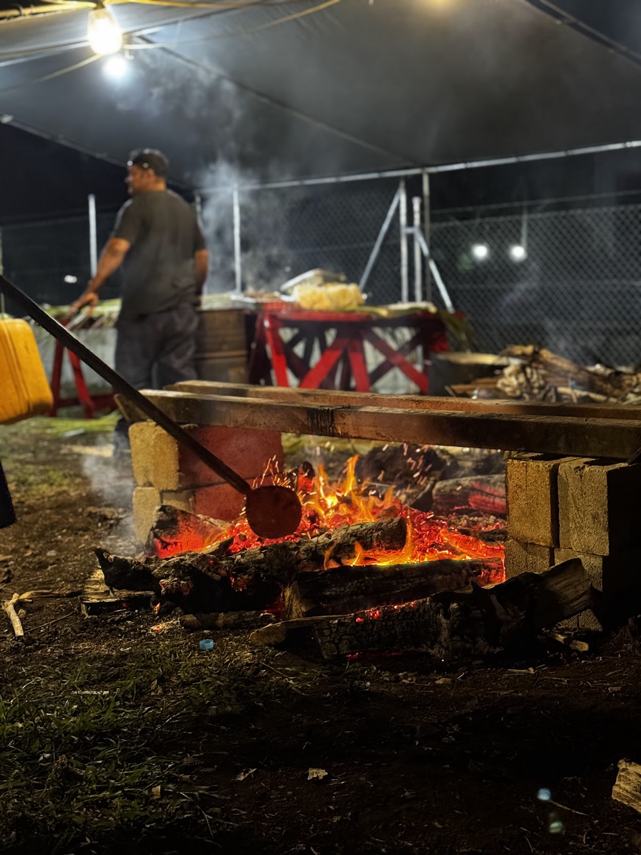 Traditional Tongan cooking over an open fire