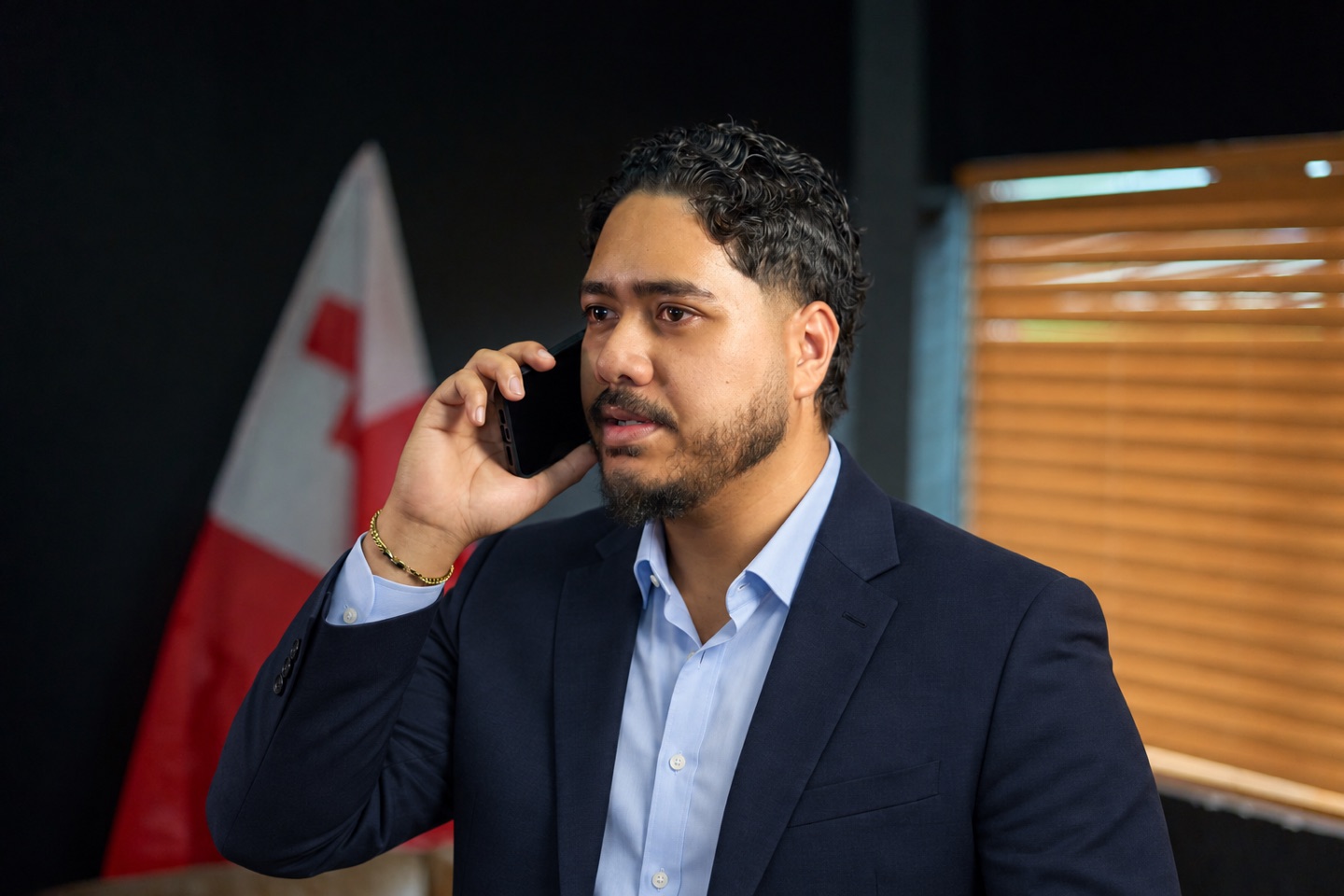 Tutone Maka speaking with a client by phone