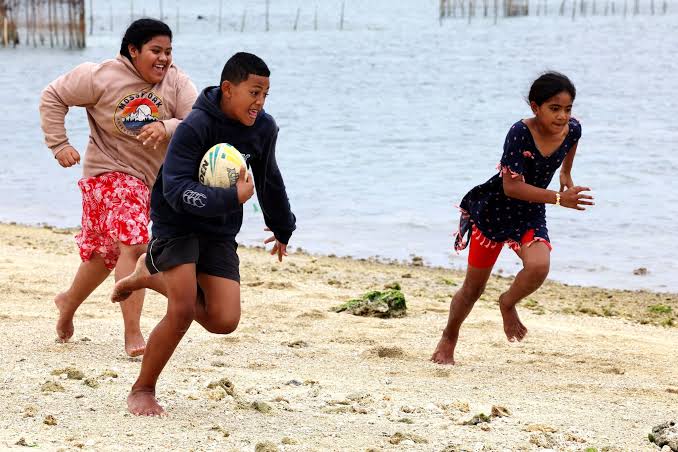 Children at a Tonga beach